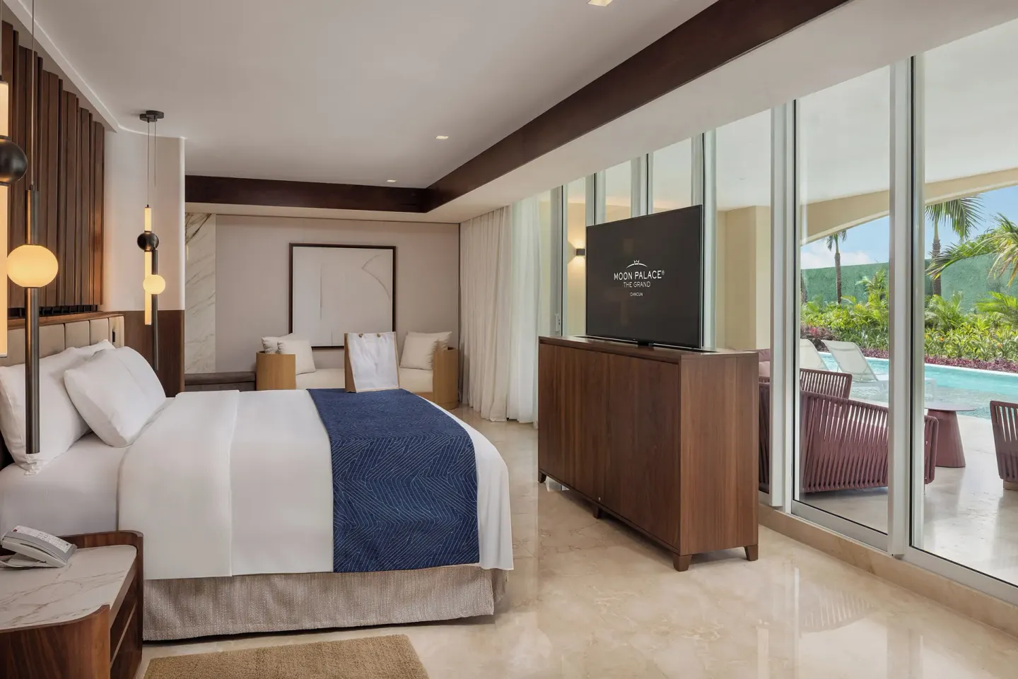 Grand Villa Pool Three Bedroom king bedroom at Moon Palace The Grand Cancun with glass doors to the pool.