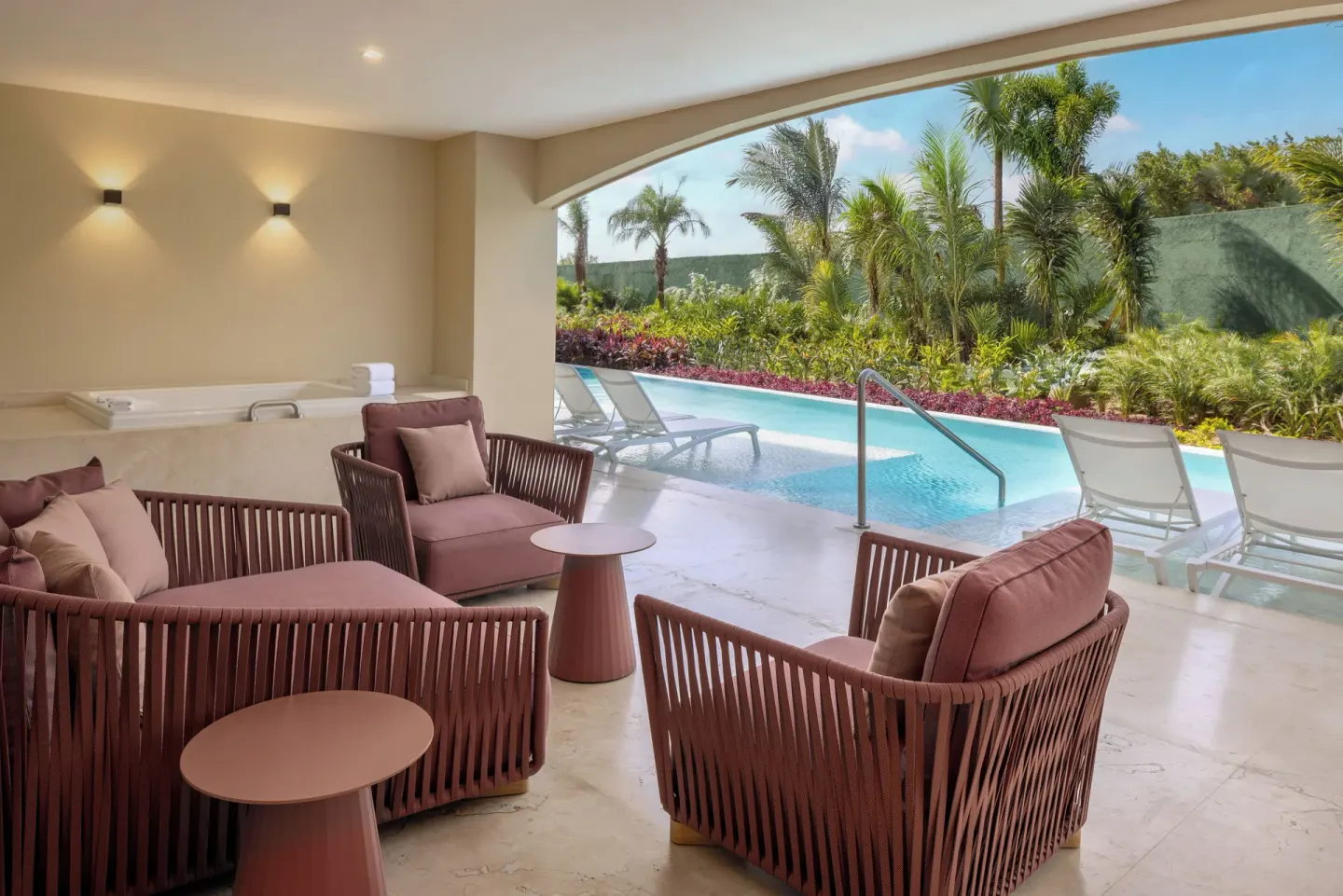 Grand Villa Pool Three Bedroom pool terrace at Moon Palace The Grand Cancun with lounge seating and spa tub.