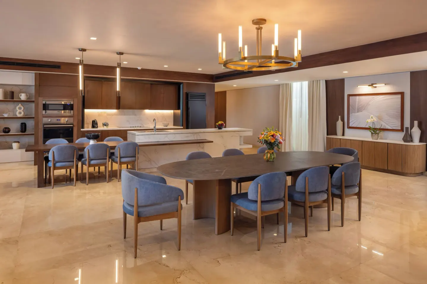 Grand Villa Sunset View Three Bedroom dining and kitchen at Moon Palace The Grand Cancun with long table.