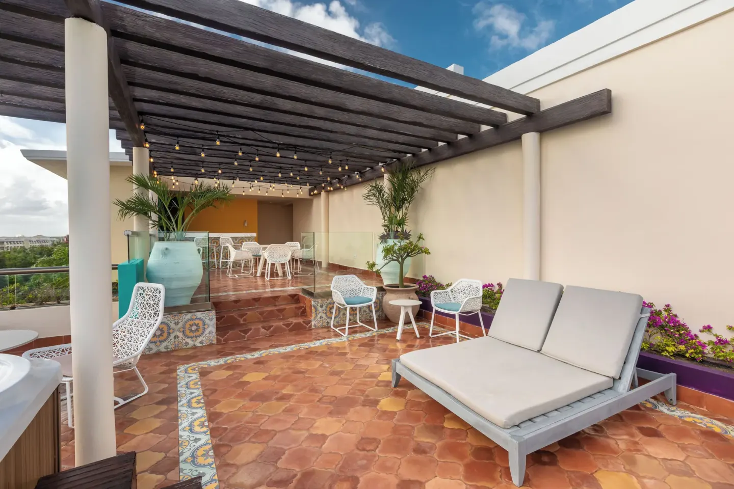 Grand Villa Three Bedroom terrace with loungers and pergola at Moon Palace The Grand Cancun.