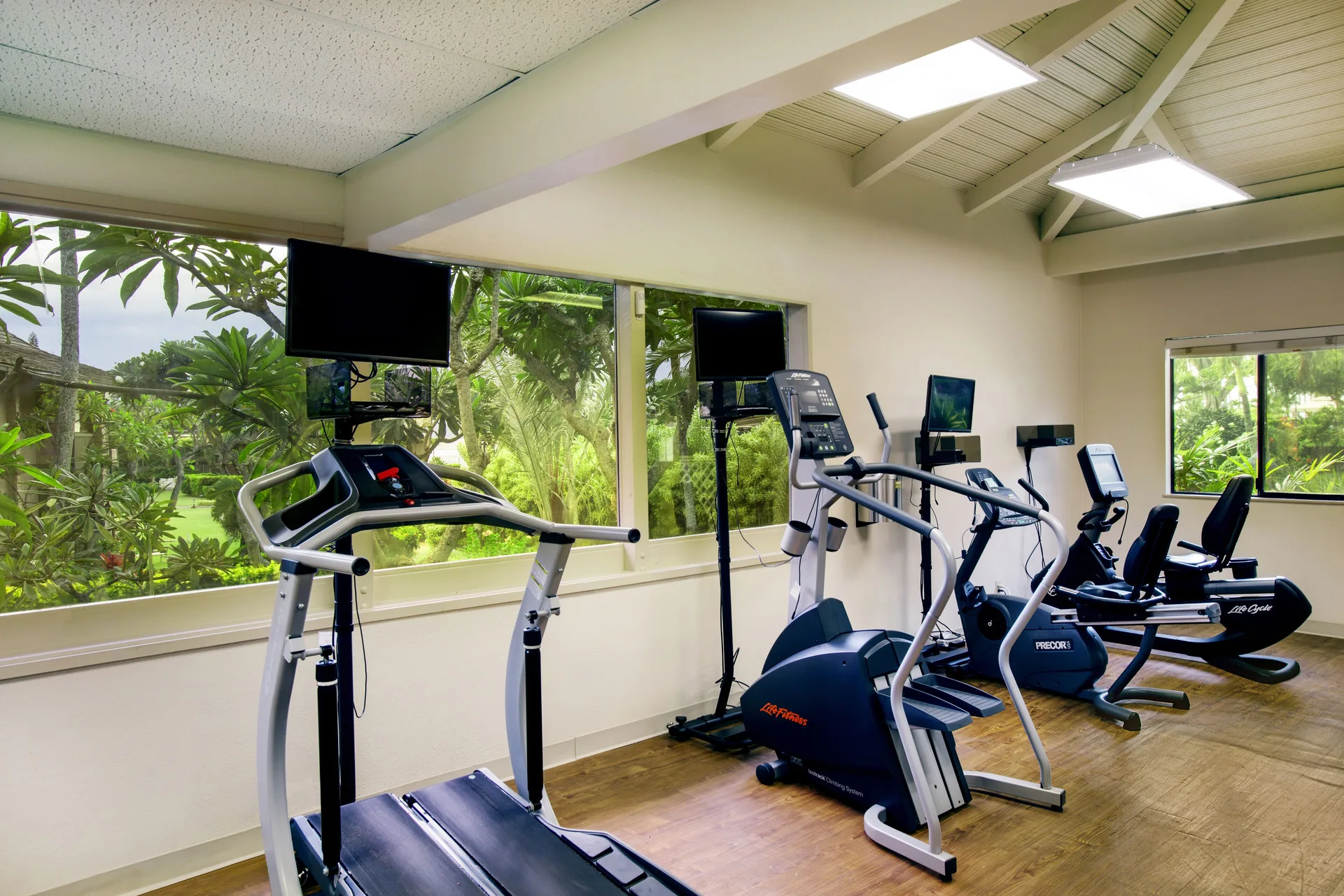 Fitness room with cardio equipment and garden windows at Napili Kai Beach Resort.