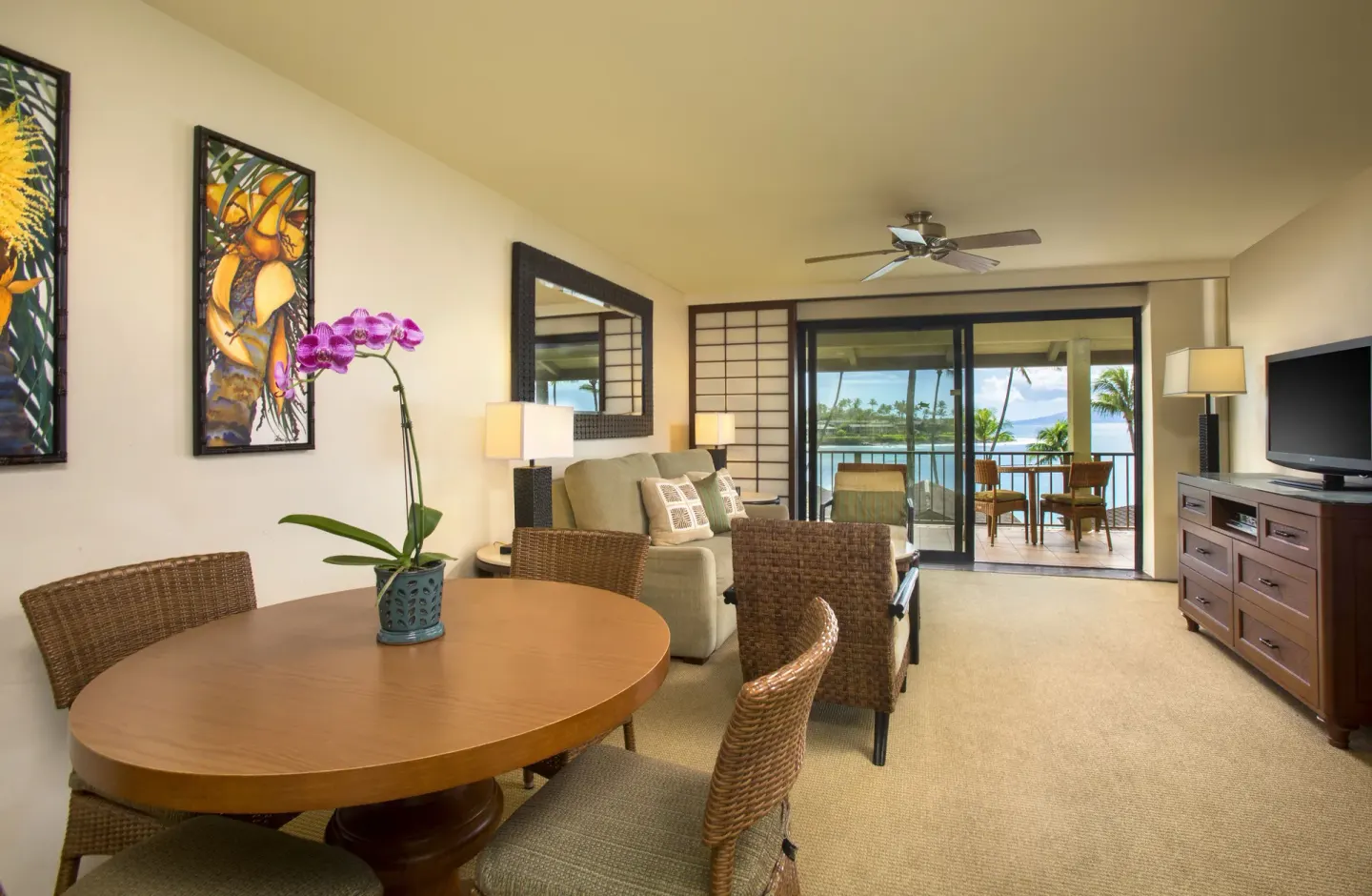 Dining and living area with ocean-facing lanai at Napili Kai Beach Resort.