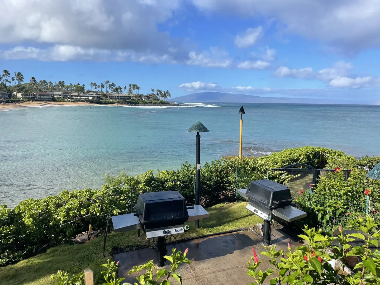 Oceanfront barbecue grills overlooking the bay at Napili Kai Beach Resort.