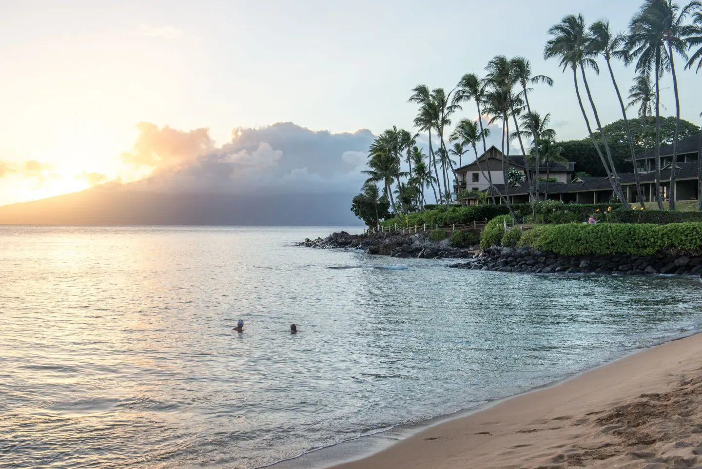 Sunset over the beach and shoreline at Napili Kai Beach Resort.