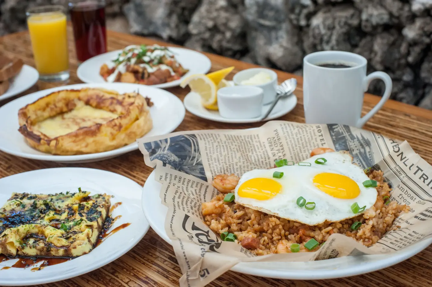 Breakfast plates with eggs, coffee, and juice at Napili Kai Beach Resort.