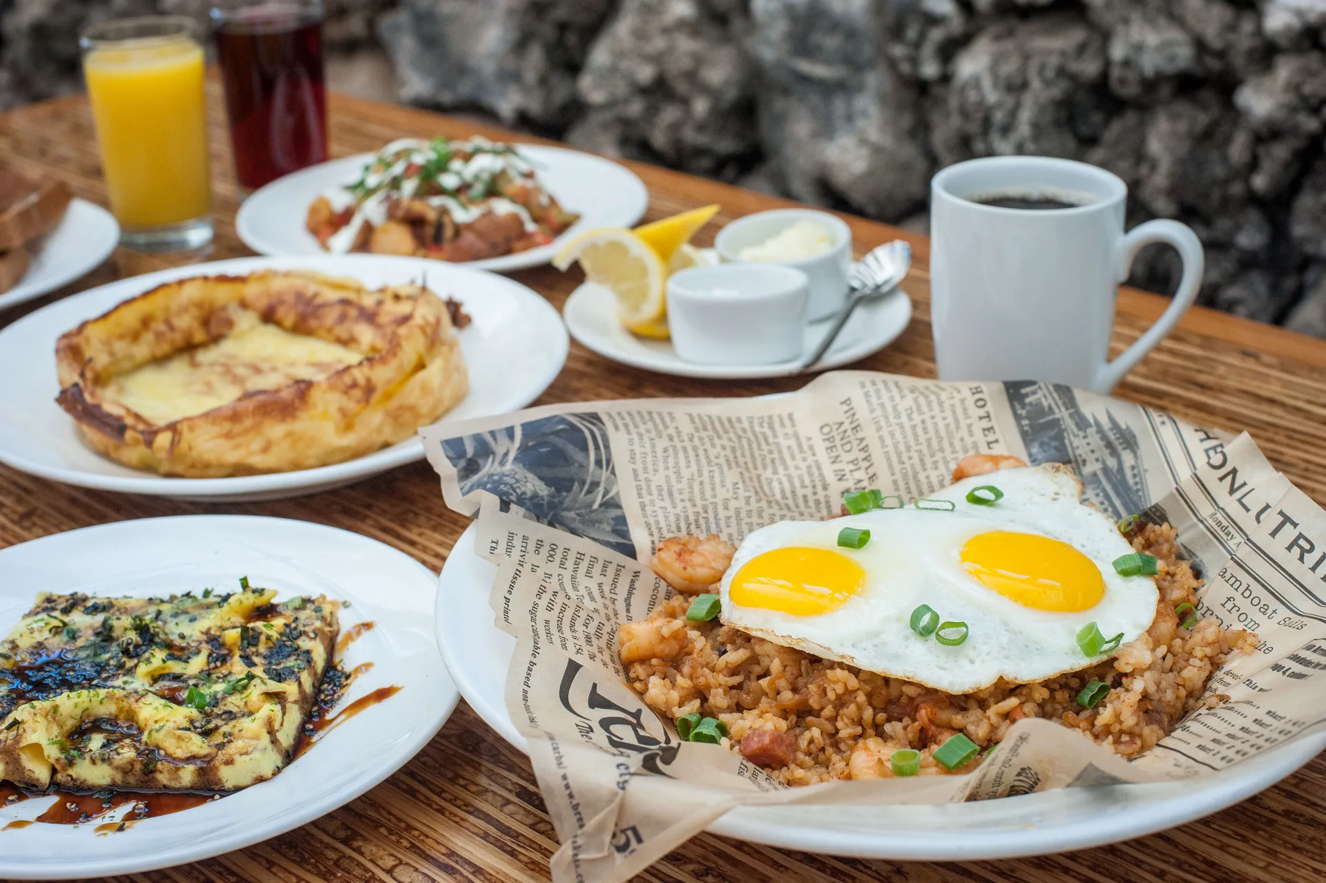 Breakfast plates with eggs, coffee, and juice at Napili Kai Beach Resort.