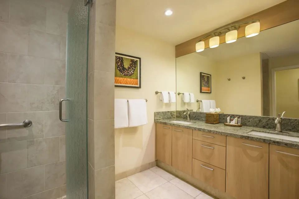 Family Studio Garden View bathroom with vanity and shower at Napili Kai Beach Resort.