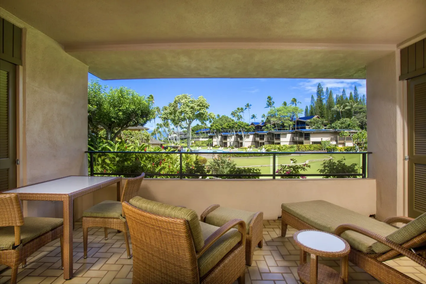 Family Studio Garden View lanai with seating at Napili Kai Beach Resort.