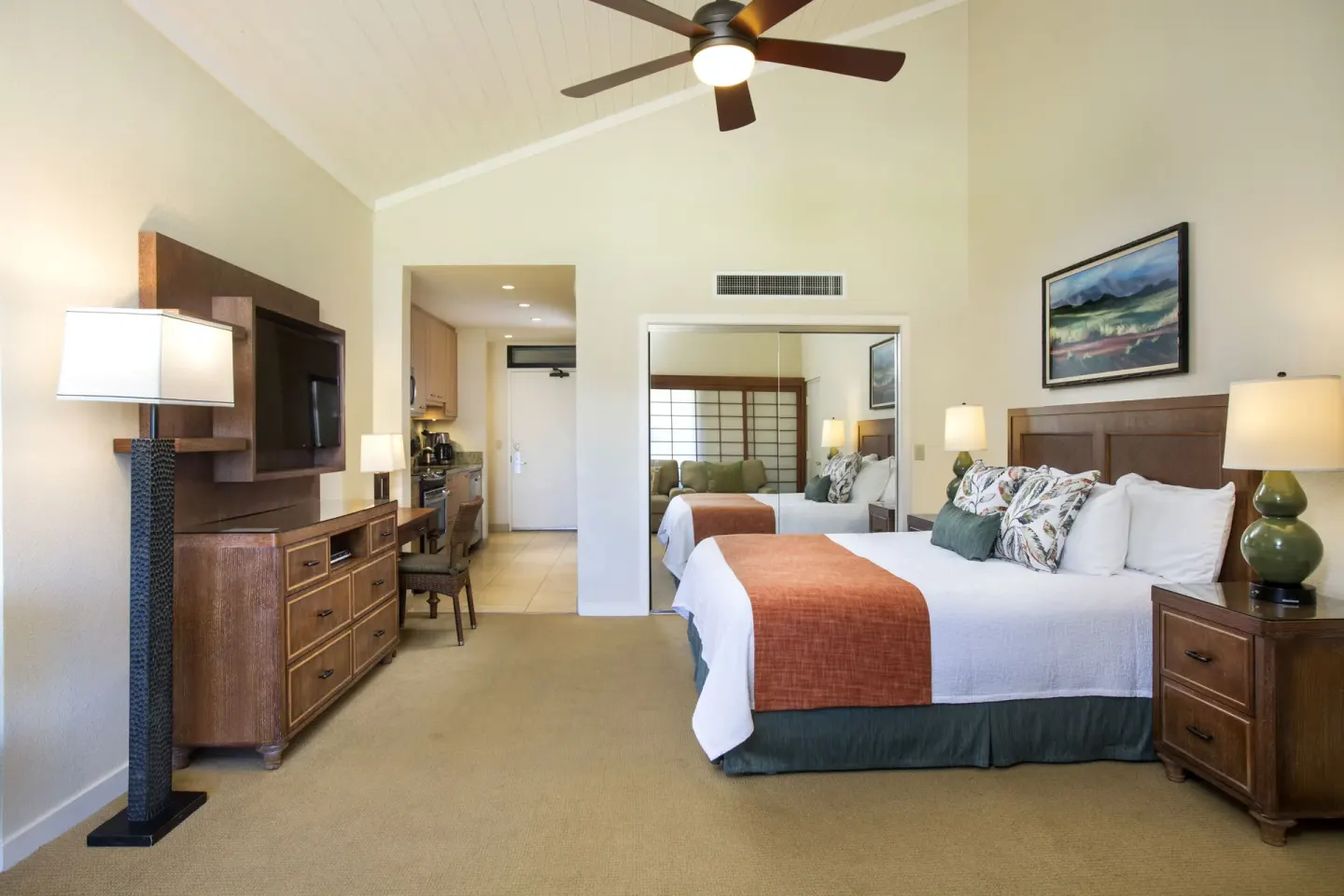 Family Studio Garden View room with king bed, TV and kitchenette at Napili Kai Beach Resort.