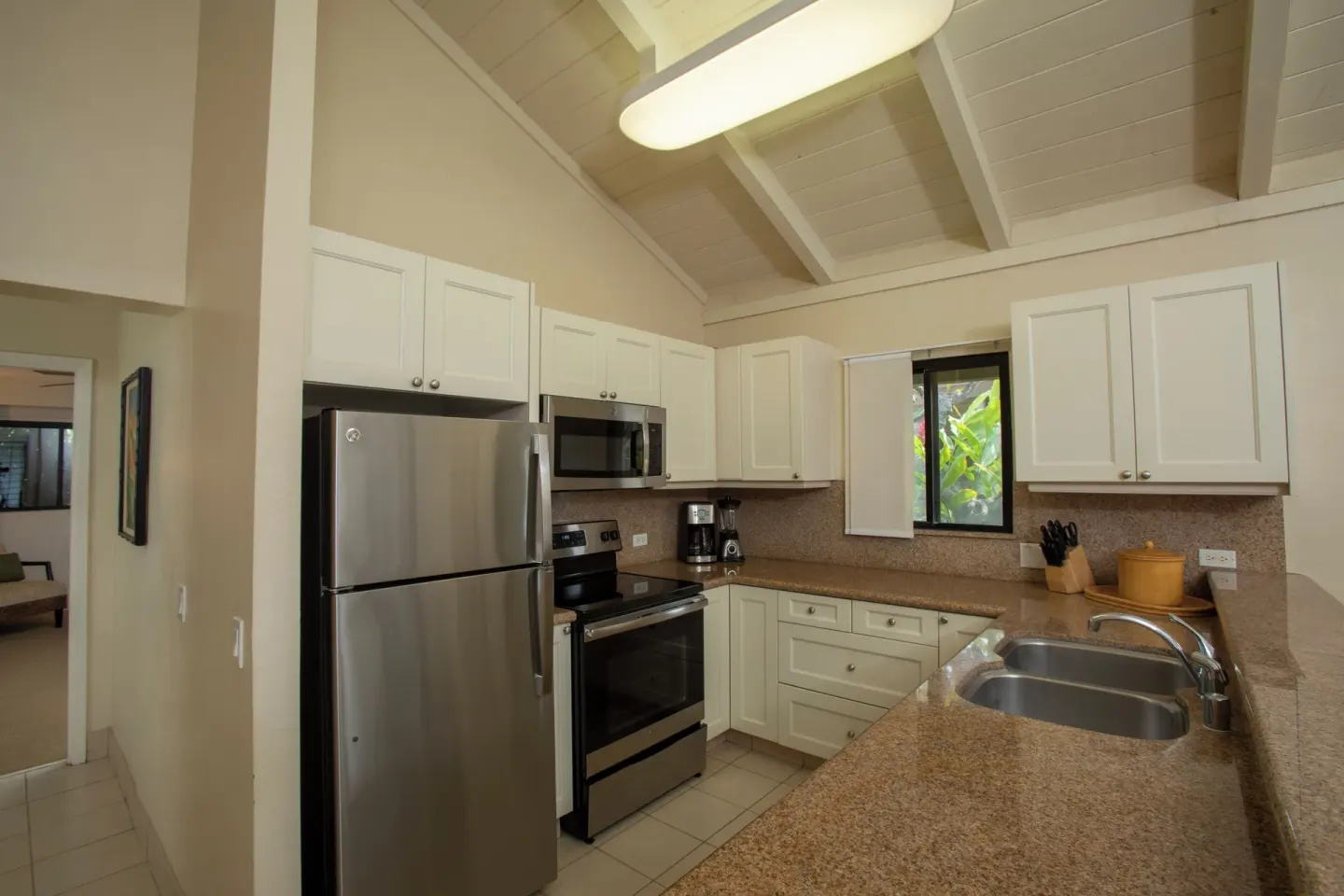 Kitchen in a two-bedroom oceanfront suite at Napili Kai Beach Resort with full-size appliances.