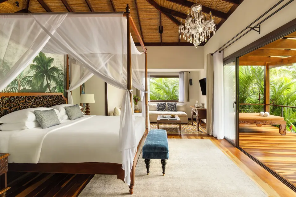 Canopy king bed suite with terrace soaking tub at Nayara Springs.