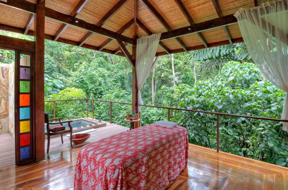 An open-air massage room overlooks dense rainforest at Nayara Springs.