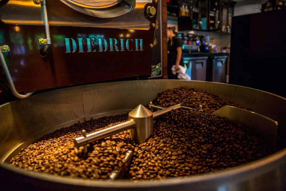 Coffee beans roasting in a drum roaster at Nayara Springs.