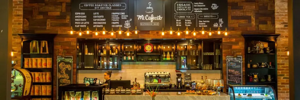 Mi Cafecito coffee bar counter and menu boards at Nayara Springs.