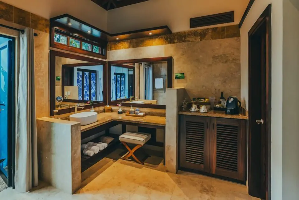Springs Villa bathroom vanity with twin mirrors and a refreshment counter at Nayara Springs.