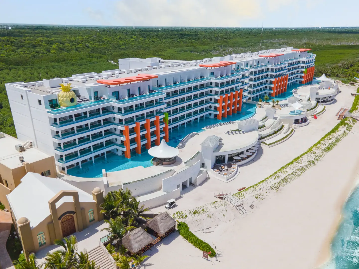 Aerial beachside view of the resort and pools at Nickelodeon Hotels & Resorts Riviera Maya.