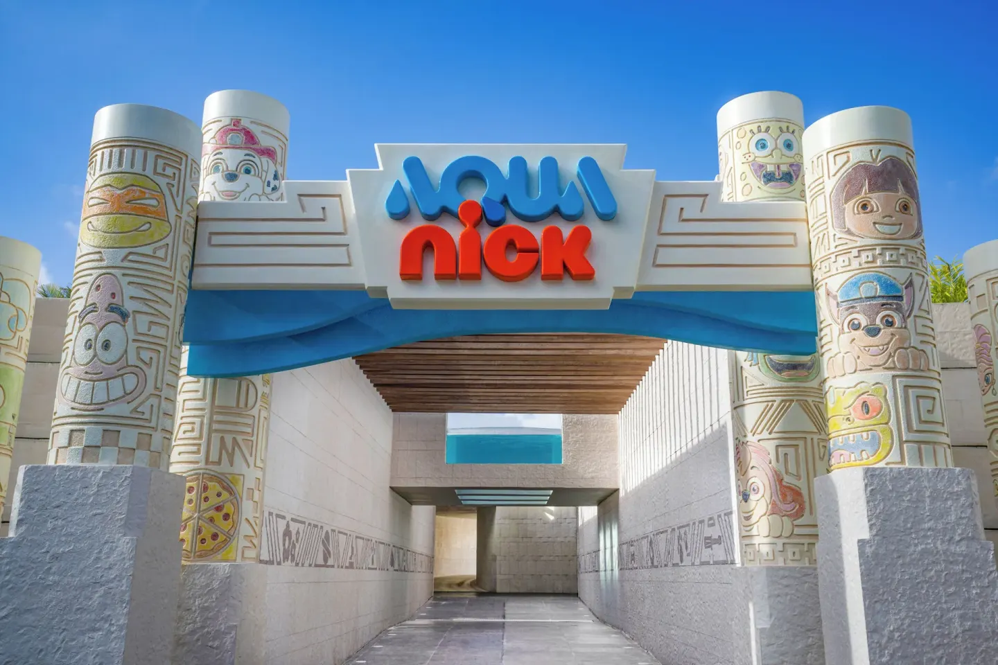 Aqua Nick entrance arch with carved columns at Nickelodeon Hotels & Resorts Riviera Maya.