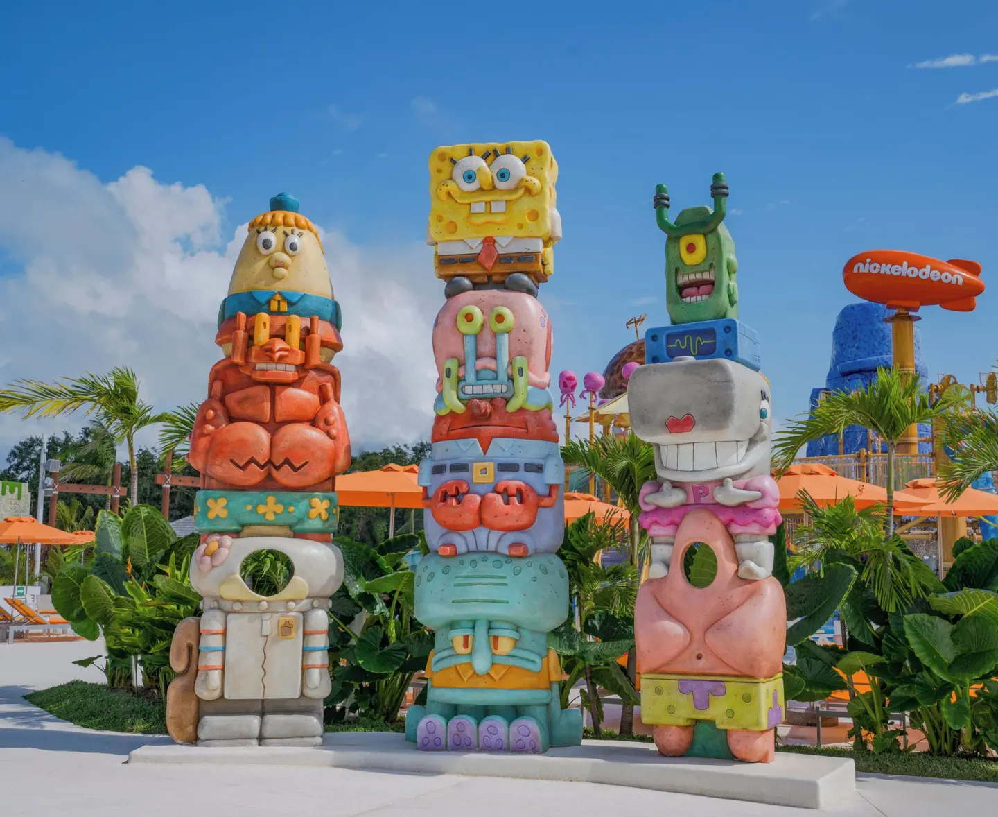 Colorful character totem sculptures stand by the pool at Nickelodeon Hotels & Resorts Riviera Maya.