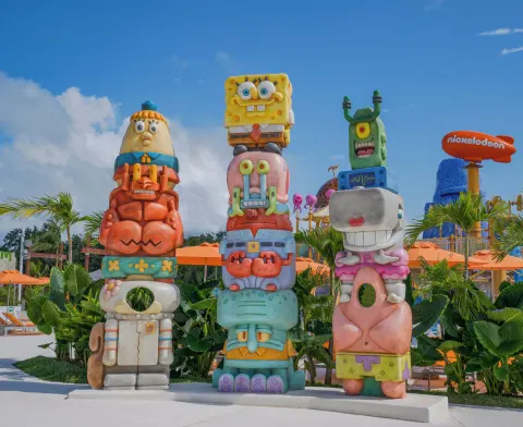 Colorful character totem sculptures stand by the pool at Nickelodeon Hotels & Resorts Riviera Maya.