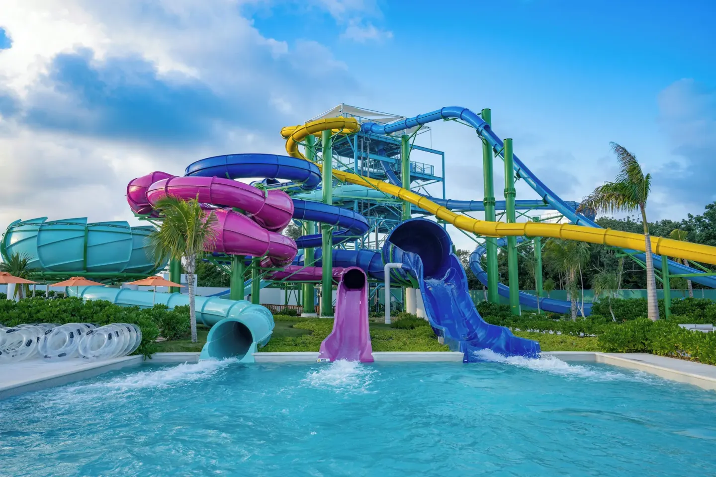 Colorful waterslides empty into a pool at Nickelodeon Hotels & Resorts Riviera Maya.