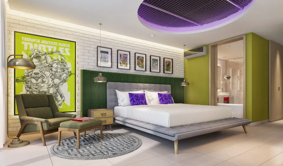 Lair Suite bedroom with king bed and Ninja Turtles art at Nickelodeon Hotels & Resorts Riviera Maya.