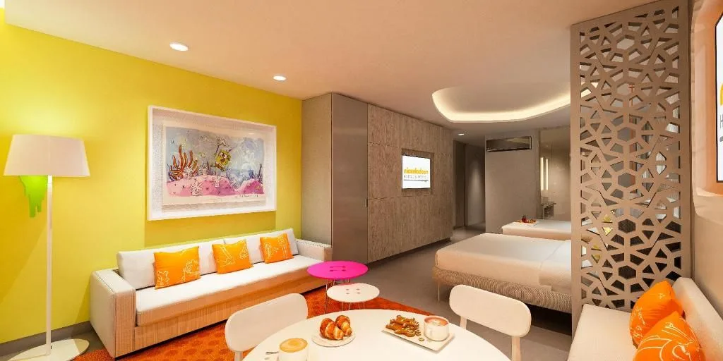 Penthouse Oceanfront Swim-Up Suite dining nook and sofa at Nickelodeon Hotels & Resorts Riviera Maya.