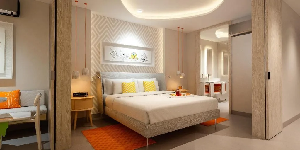 Penthouse Oceanfront Swim-Up Suite king bed at Nickelodeon Hotels & Resorts Riviera Maya.