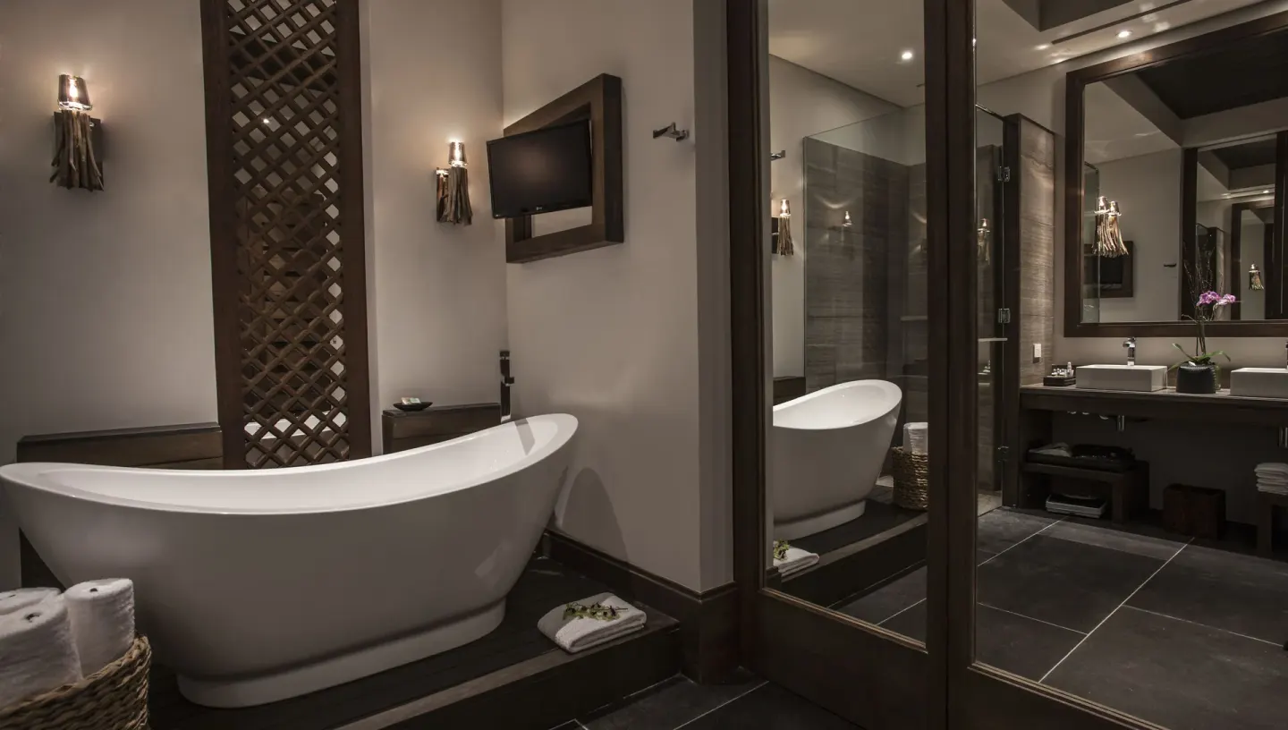 Junior Suite garden bathroom with soaking tub and double vanity at Nizuc Resort and Spa.