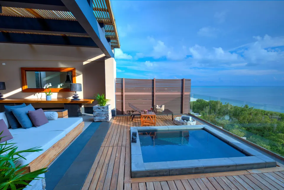 Penthouse terrace with plunge pool, daybed and ocean view at Nizuc Resort and Spa.