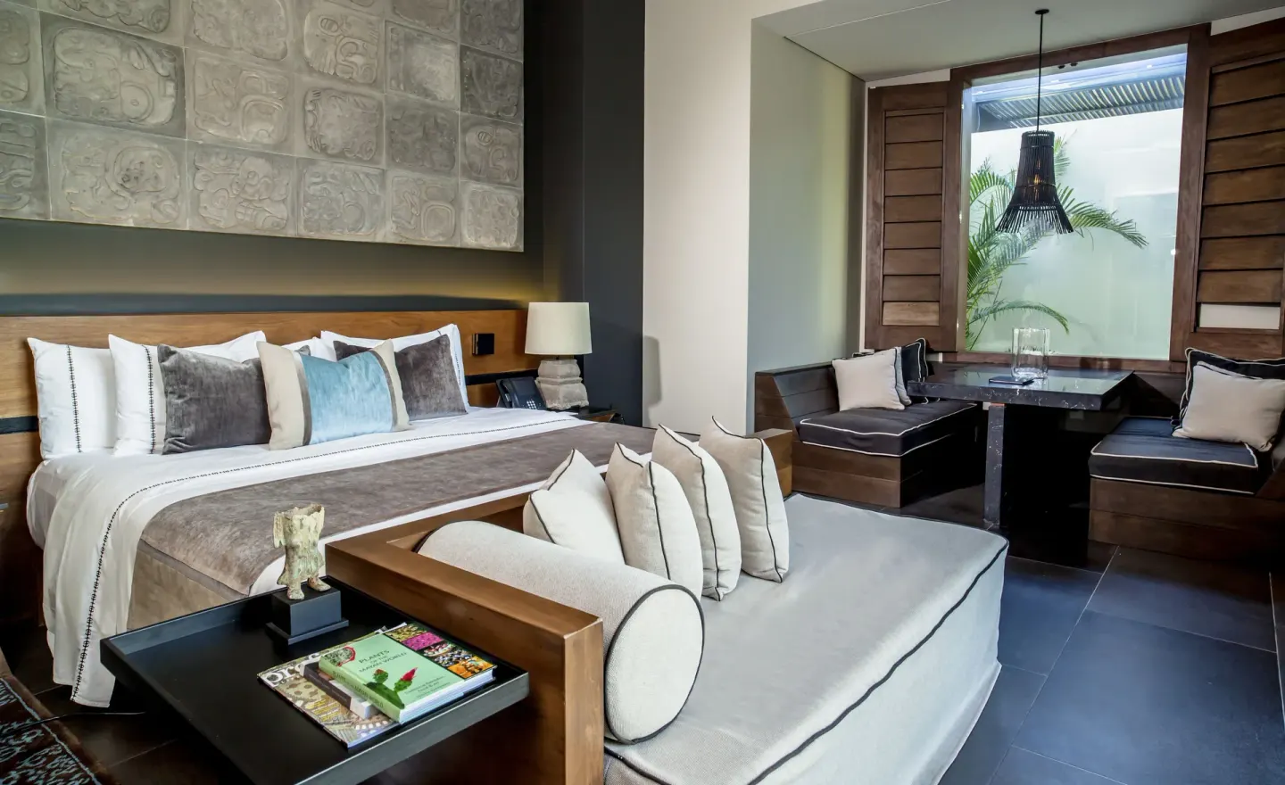 Private Pool Pavilion Villa bedroom with king bed and window seating at Nizuc Resort and Spa.