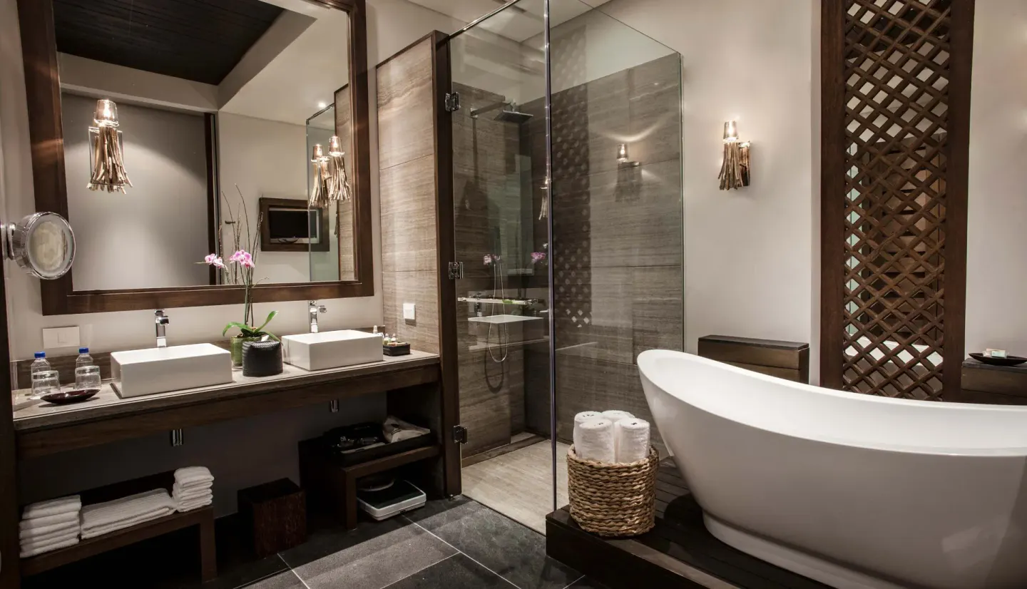Garden view room bathroom with double vanity and tub at Nizuc Resort and Spa.
