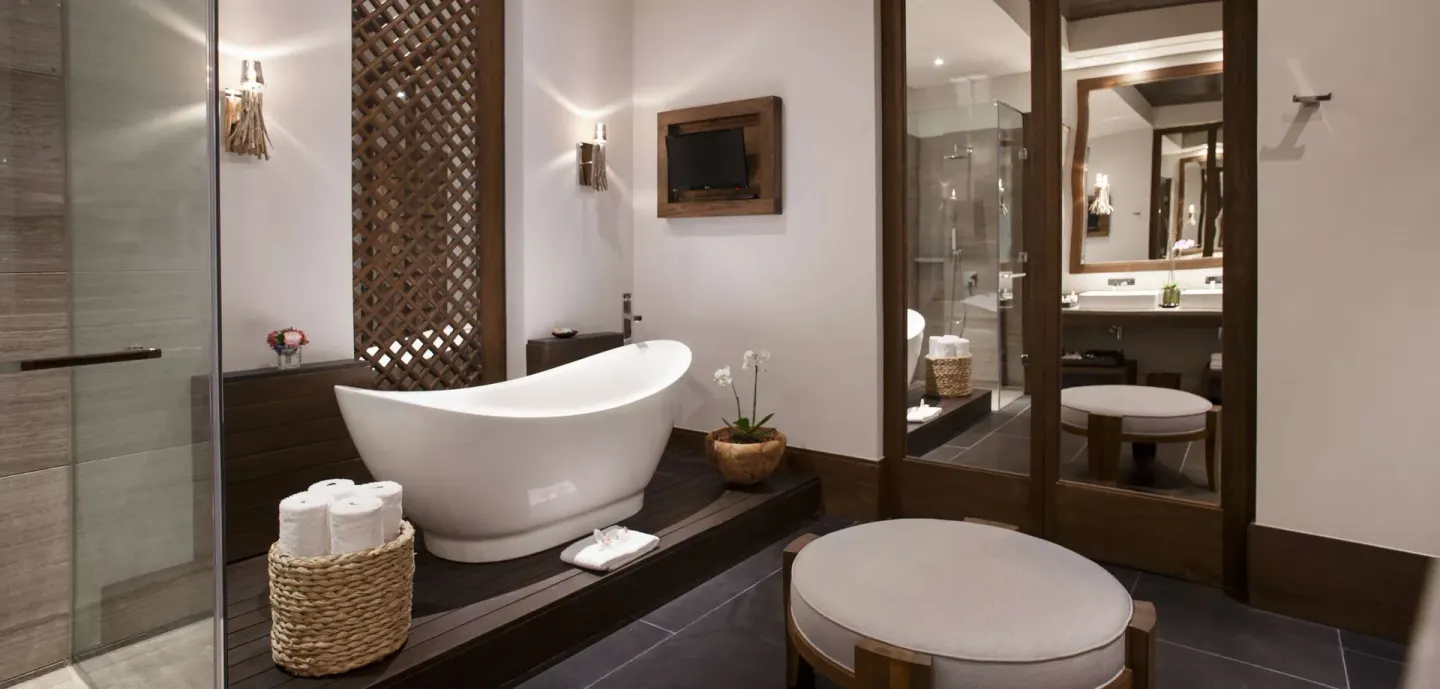 Garden view room bathroom with freestanding tub at Nizuc Resort and Spa.