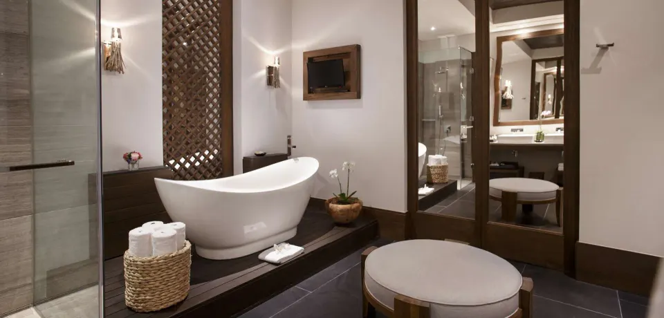 Garden view room bathroom with freestanding tub at Nizuc Resort and Spa.