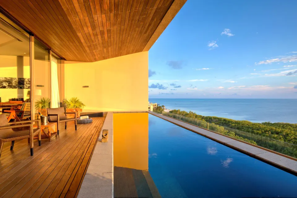 Master Suite terrace at Nizuc Resort and Spa with wood deck, plunge pool and ocean view.