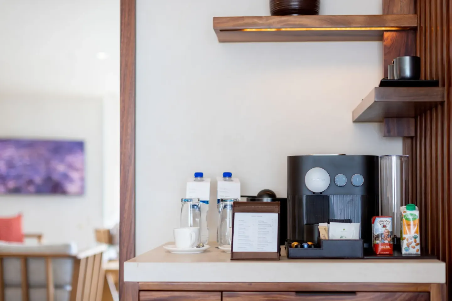 Guest room coffee station with machine, cups and drinks at Nobu Hotel Los Cabos.