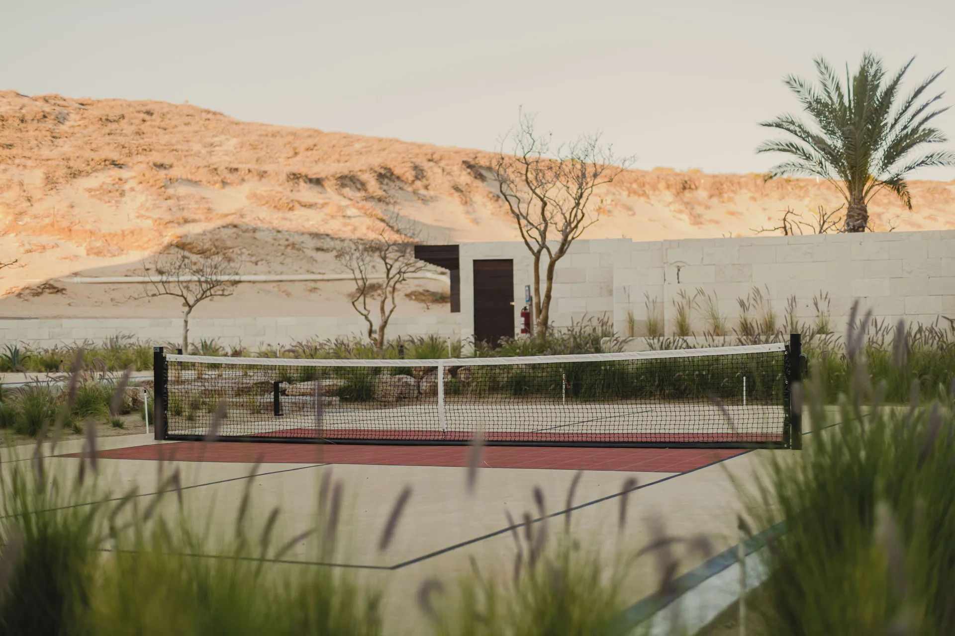 Pickleball court with desert landscaping at Nobu Hotel Los Cabos.