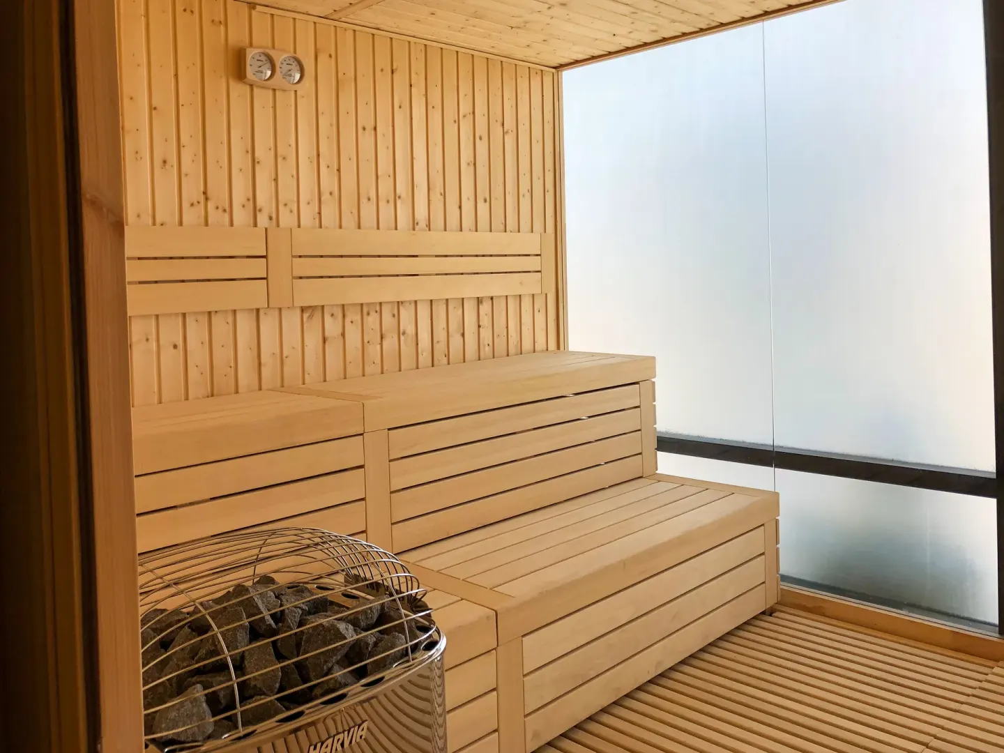 A wood-lined sauna with bench seating at Nobu Hotel Los Cabos.