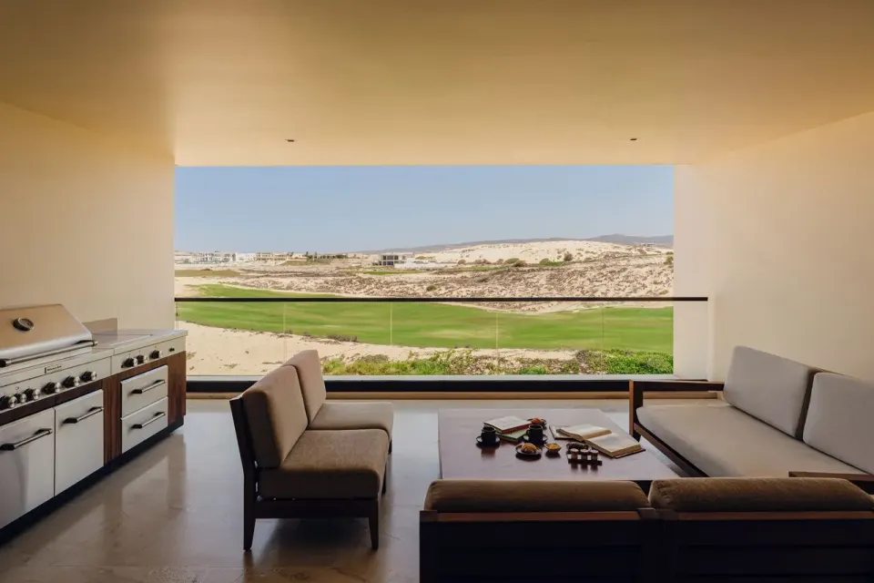 Asahi 2 Bedrooms covered terrace with sofas and outdoor grill at Nobu Hotel Los Cabos.