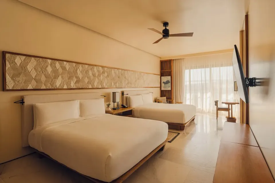 Kogane Penthouse bedroom with two queen beds at Nobu Hotel Los Cabos.