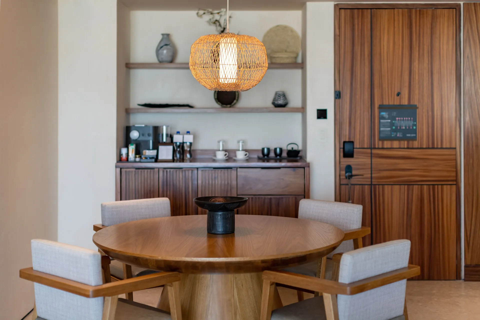 Dining table and refreshment bar in a Luxury Room Ocean View at Nobu Hotel Los Cabos.