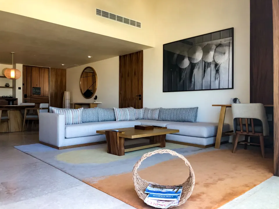 Lounge seating and desk in a Luxury Room Ocean View at Nobu Hotel Los Cabos.