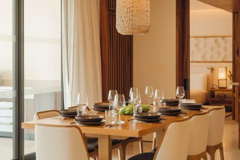 Sakyu 3 Bedrooms dining table set with glassware at Nobu Hotel Los Cabos.
