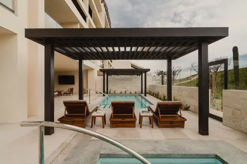 Sakyu 3 Bedrooms terrace pool with loungers and pergolas at Nobu Hotel Los Cabos.