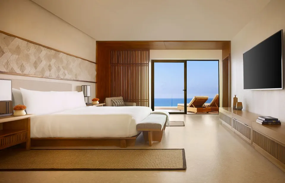 Ocean View Suite bedroom with king bed and terrace at Nobu Hotel Los Cabos.