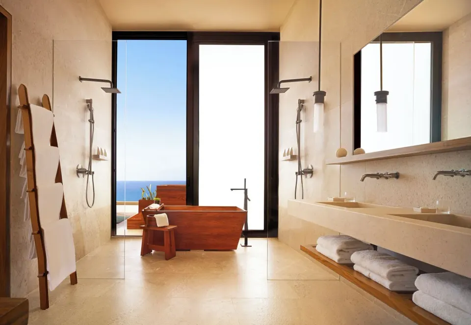 Oceanfront suite bathroom with soaking tub and ocean view at Nobu Hotel Los Cabos.