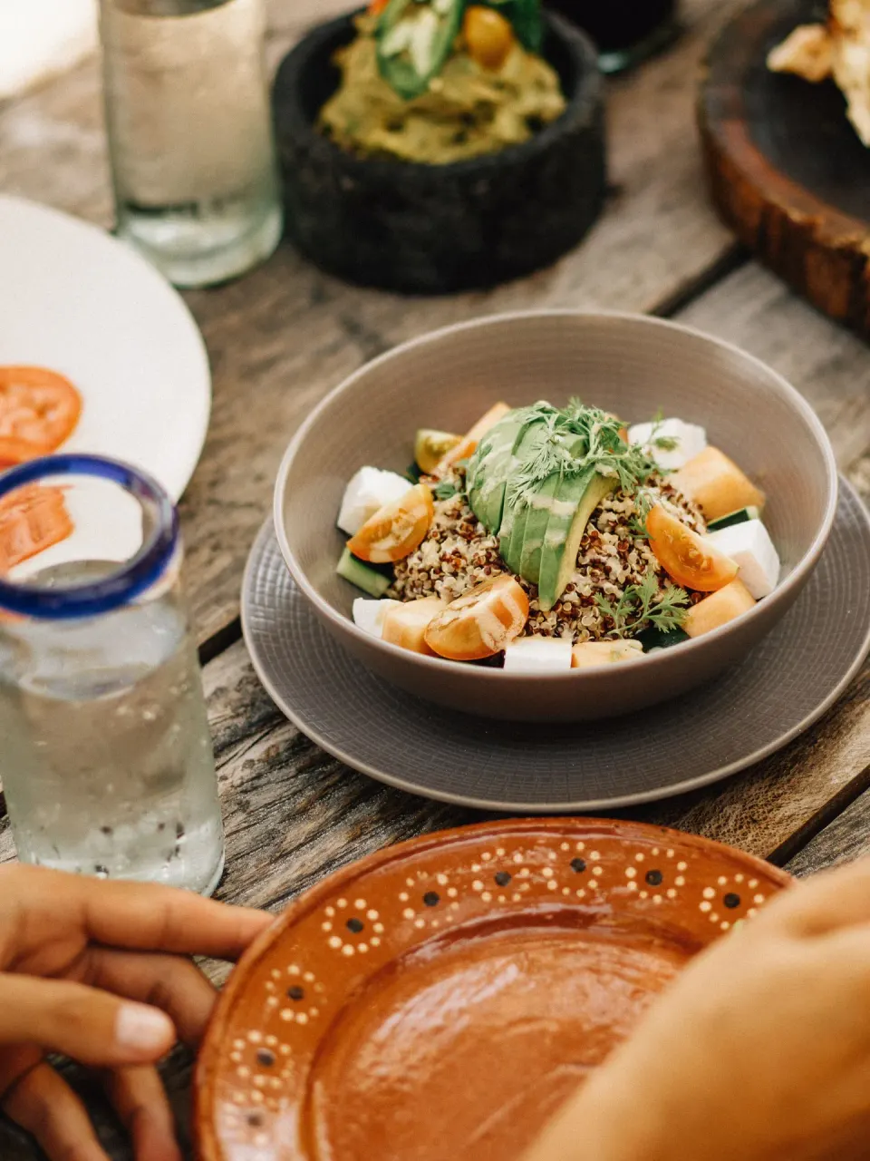 Quinoa bowl with avocado and citrus segments at Nômade Temple Tulum