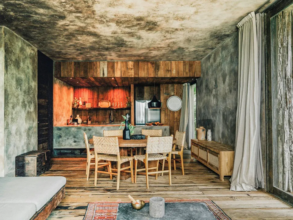 Open-plan living and dining area in a Deluxe Ocean View room at Nômade Temple Tulum