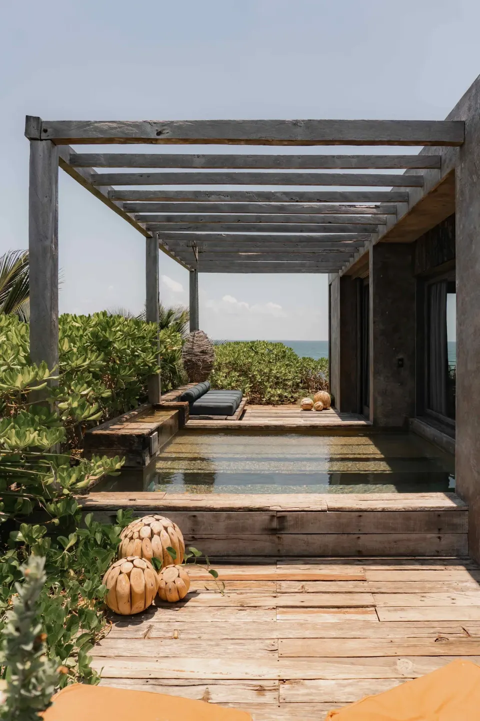 Wooden deck with pergola, plunge pool and ocean view from a Suite, Ocean View at Nômade Temple Tulum.