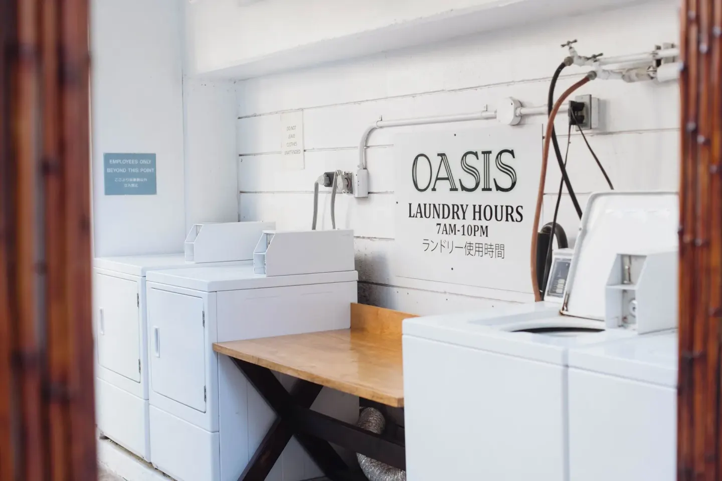 Guest laundry room with washers and dryers at Oasis Hotel Waikiki.