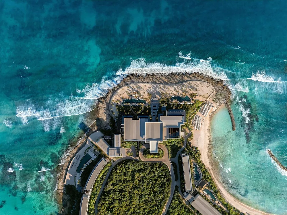 Hilton Tulum Playa del Carmen All-Inclusive Resort with coastal setting, family amenities and modern pools